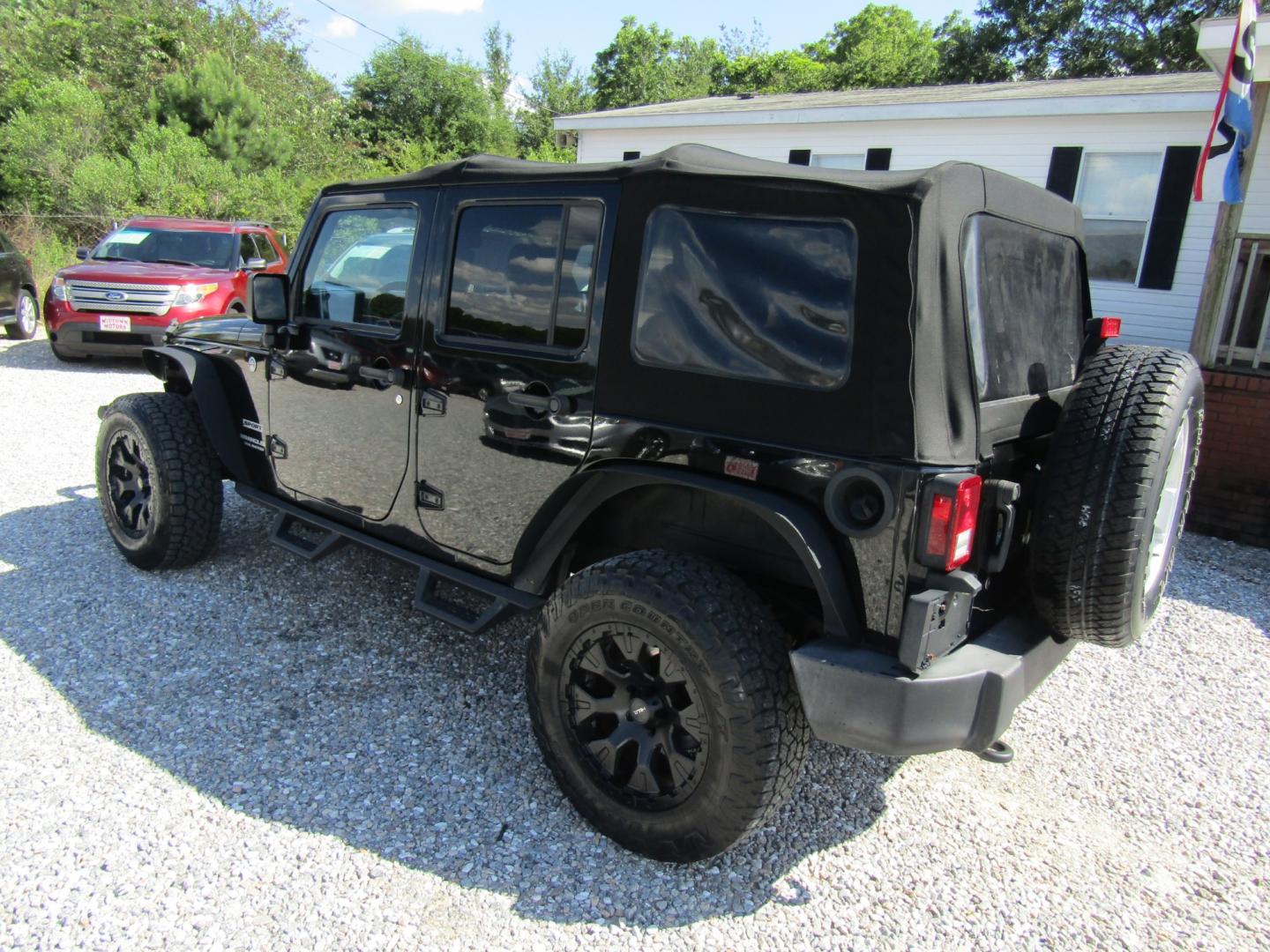 2015 Black /Tan Jeep Wrangler (1C4BJWDG8FL) with an V6 engine, Automatic transmission, located at 15016 S Hwy 231, Midland City, AL, 36350, (334) 983-3001, 31.306210, -85.495277 - Photo#5